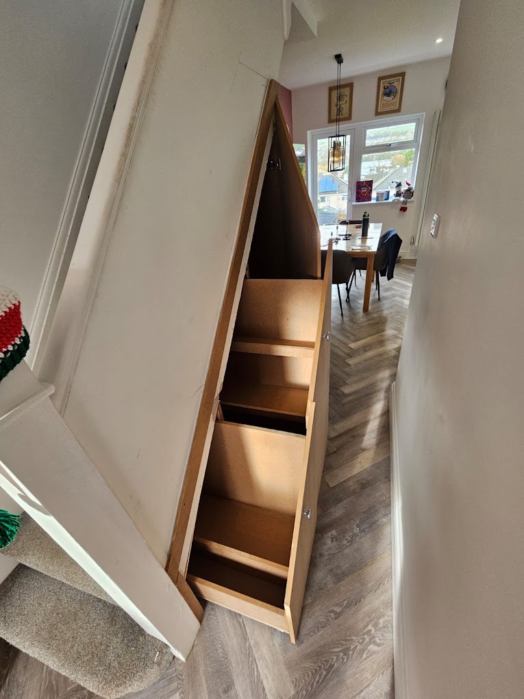 Bespoke under-stairs storage by Soper Carpentry